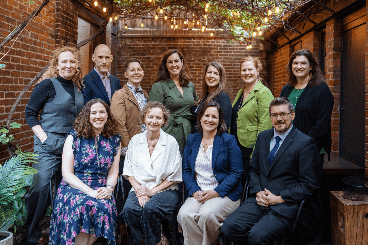 The Avalon senior leadership team in a courtyard